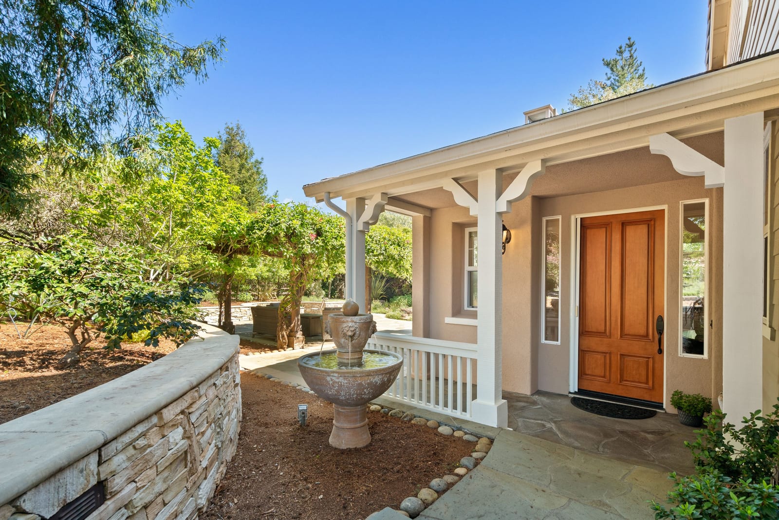 Front porch entry with stone fountain